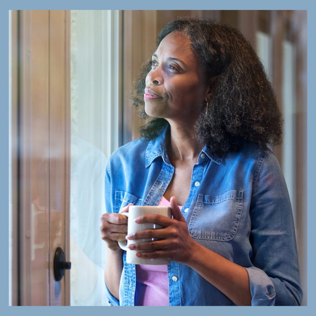 Woman thinking on reflections and plans for 2023.